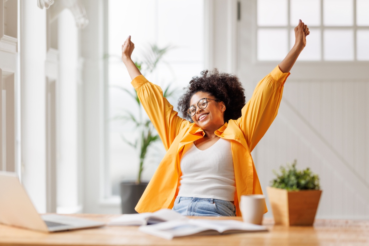 a woman with her arms up